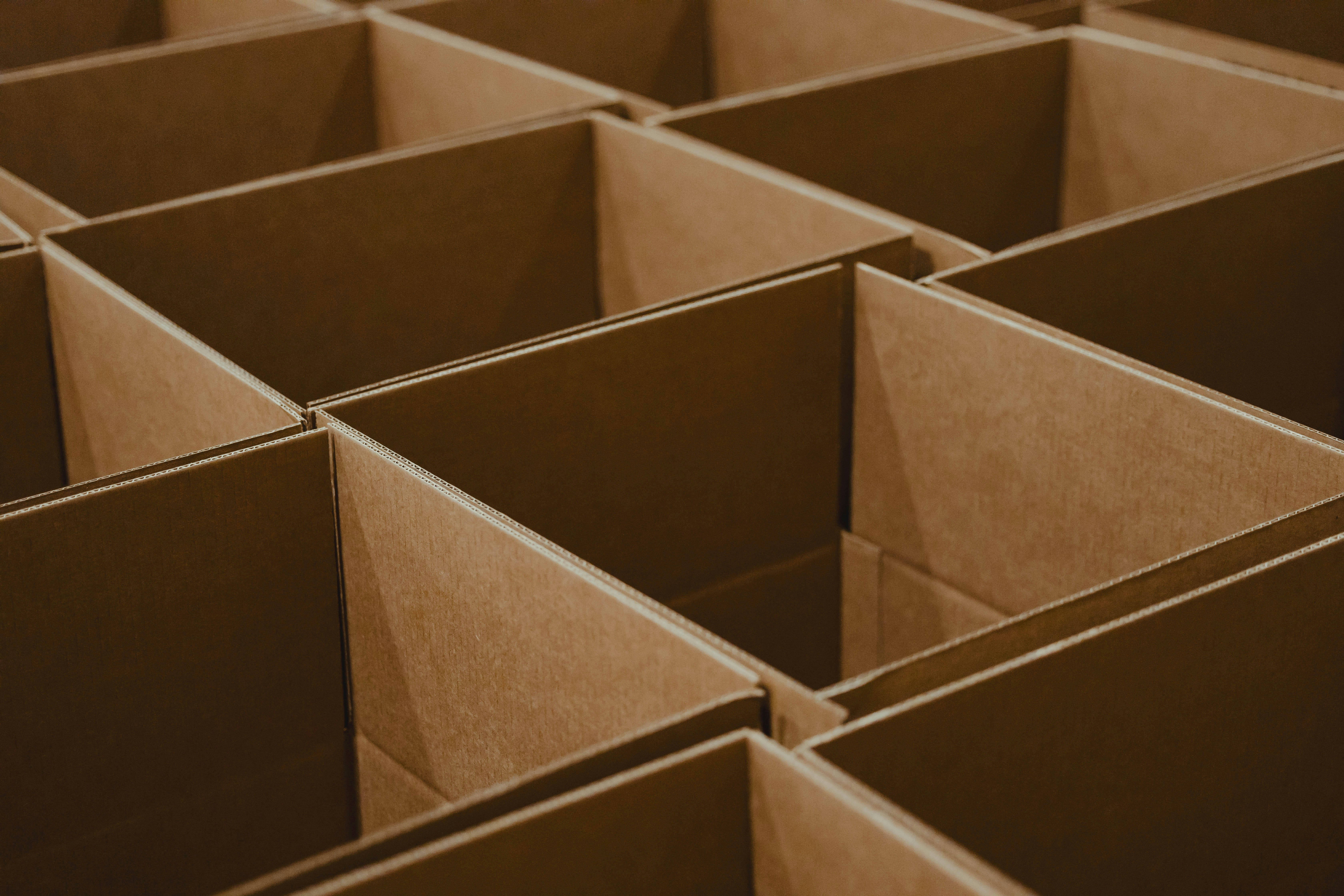 Open cardboard boxes of sourced products awaiting dispatch in a China warehouse